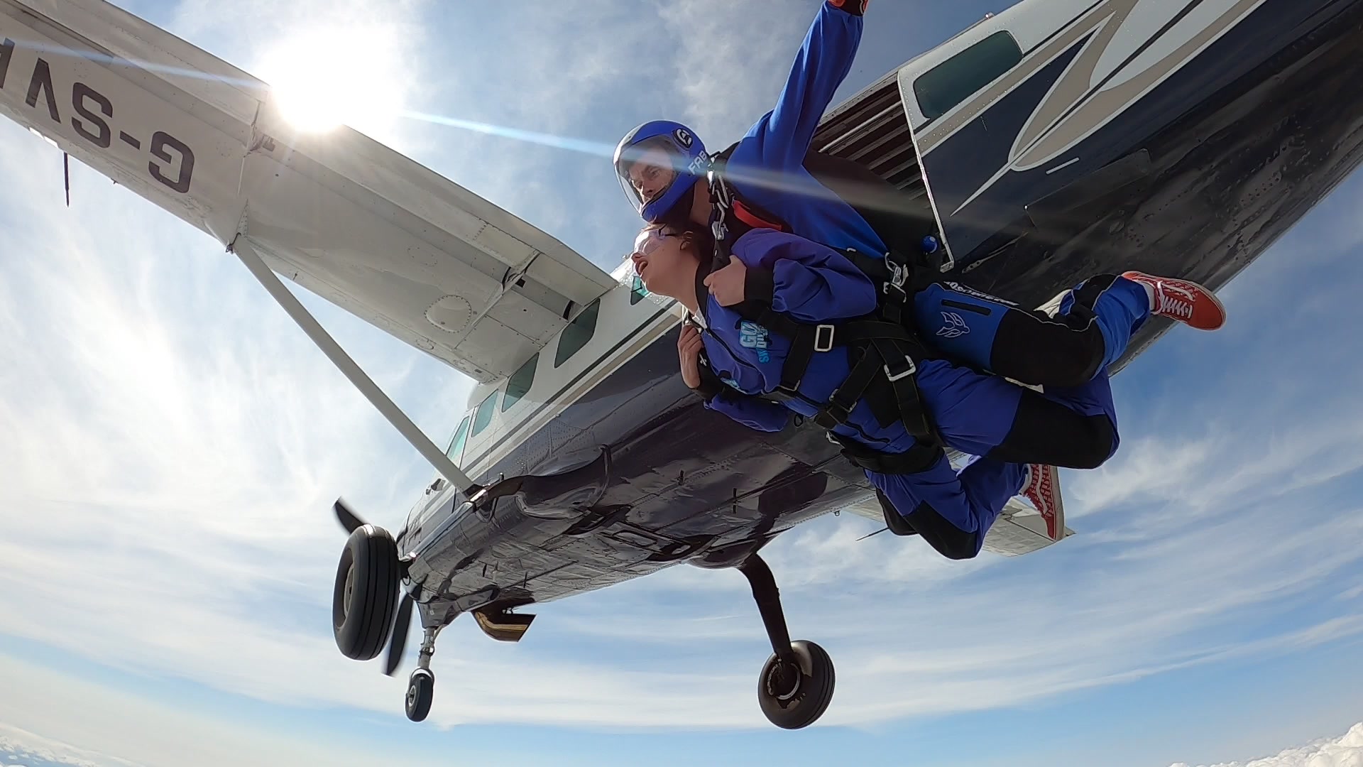 skydivers exiting the plane