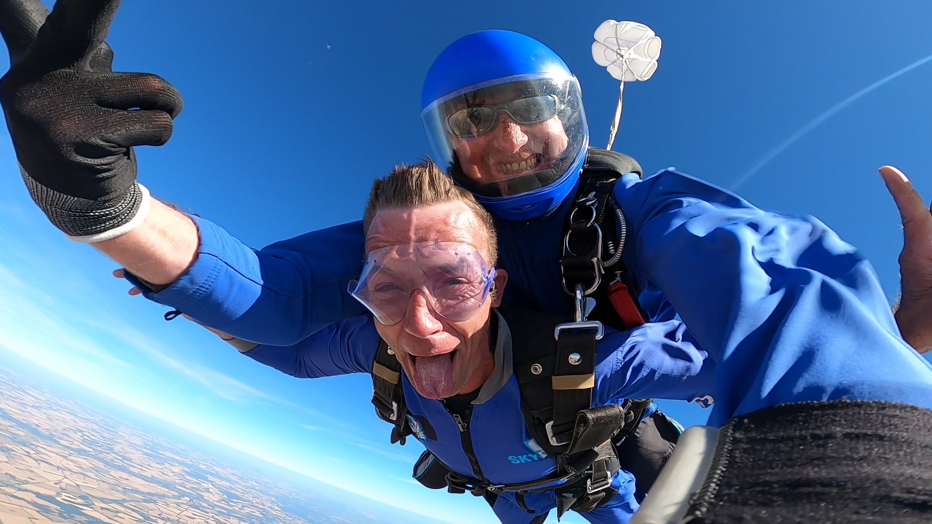 Skydive instructor with customer filming on handcam