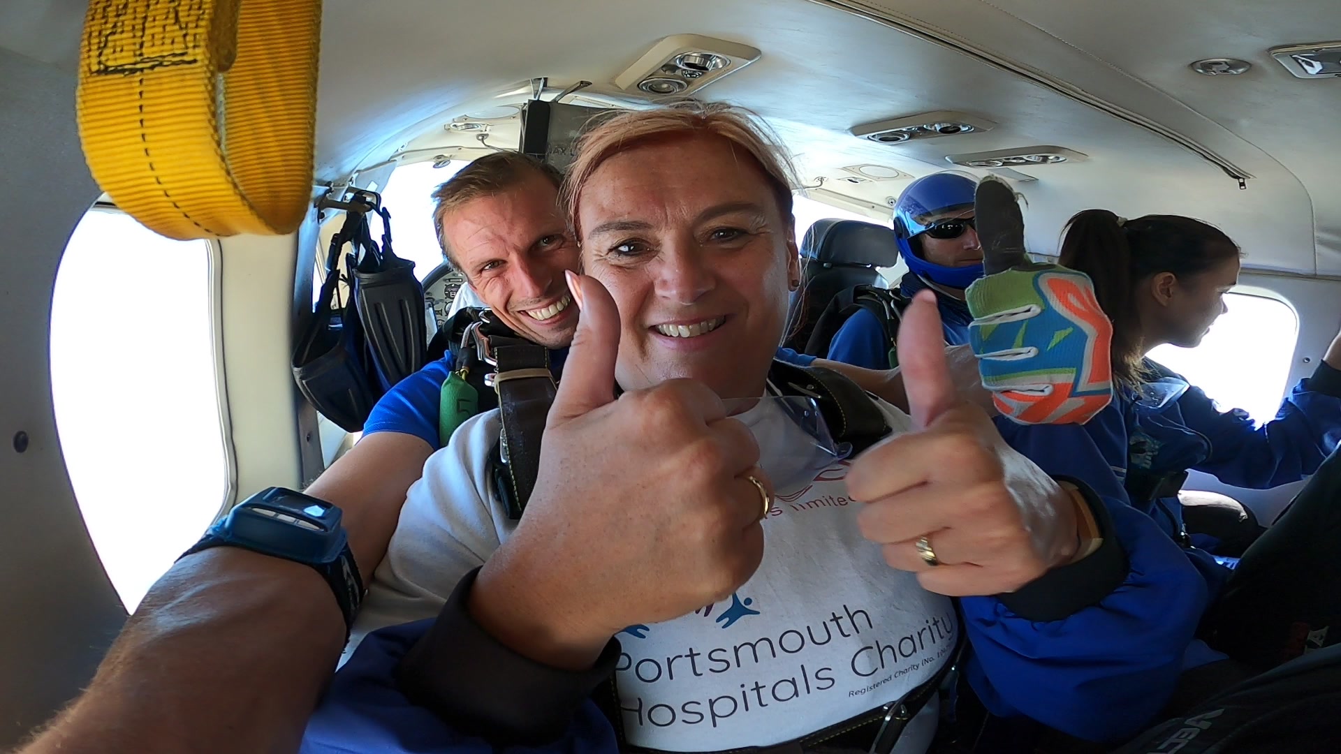 instructor and customer sat in the plane thumbs up