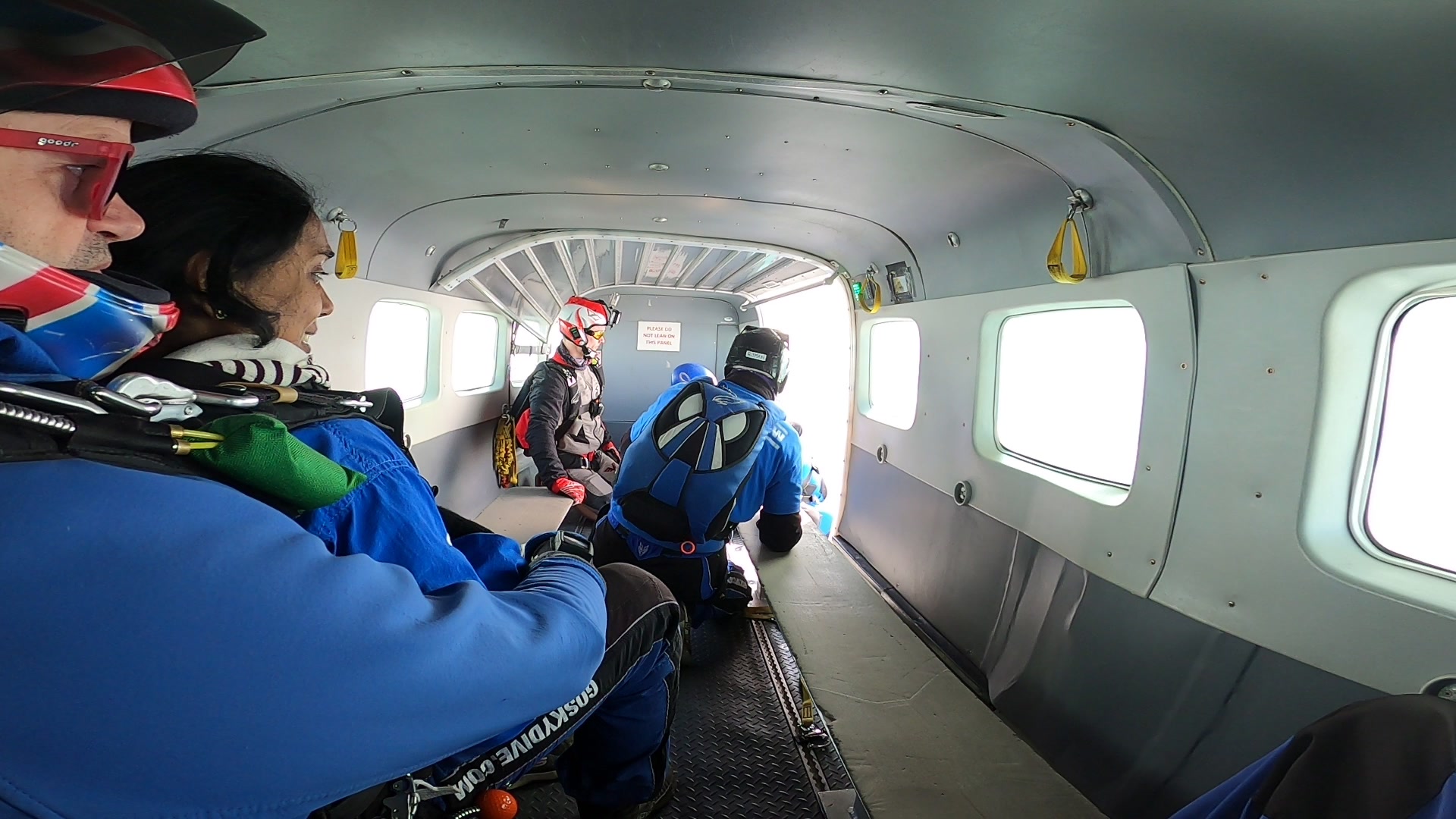 Skydivers preparing in plane