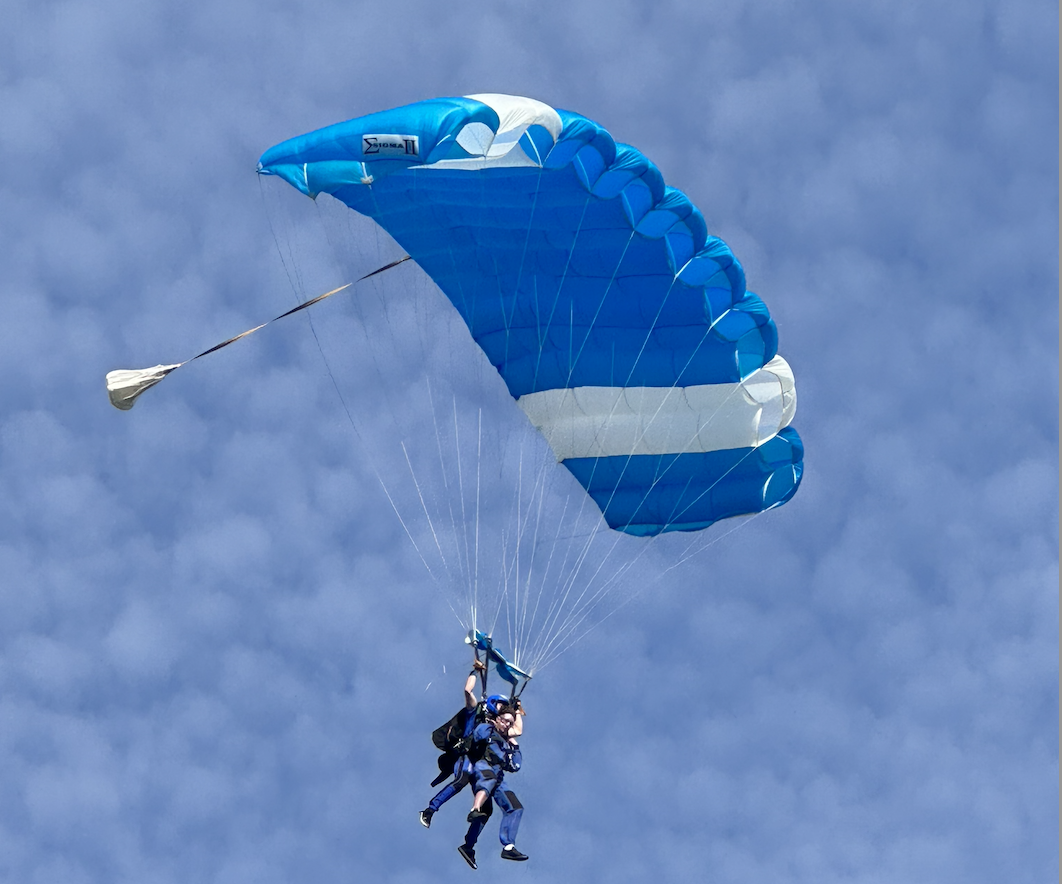 Tandem skydiver with parachute deployed